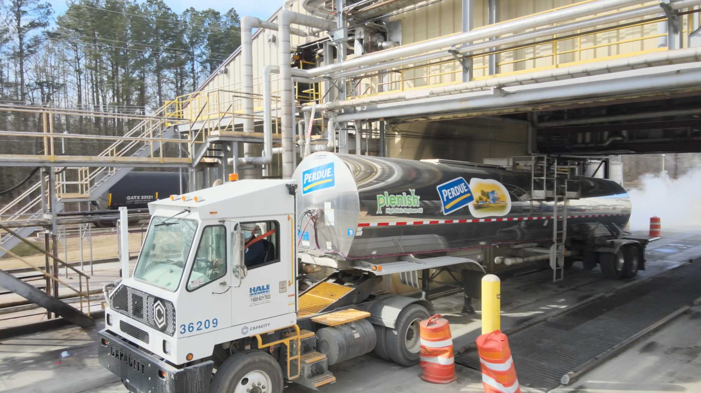 Perdue Oils truck in an industrial setting.